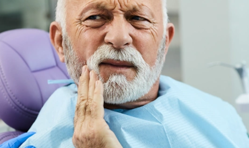Patient experiencing severe tooth pain at night seeking emergency dental care in NYC